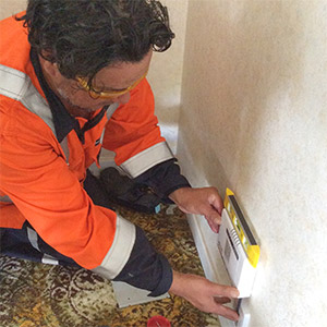 Technician installing UFB in house